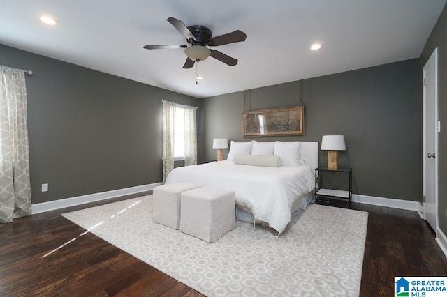 bedroom with ceiling fan and dark hardwood / wood-style floors