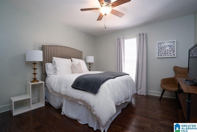 bedroom with ceiling fan and dark hardwood / wood-style flooring