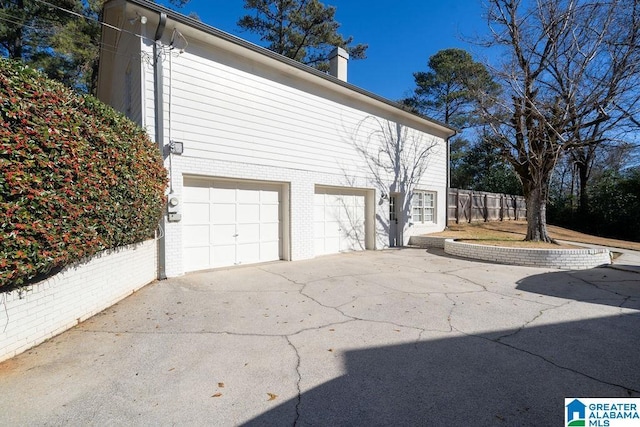 view of property exterior with a garage