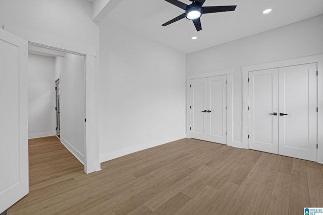 unfurnished bedroom featuring ceiling fan and light hardwood / wood-style flooring