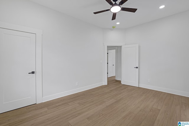 unfurnished room featuring ceiling fan and light wood-type flooring