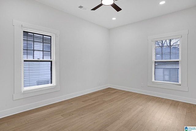 empty room with light hardwood / wood-style flooring and ceiling fan