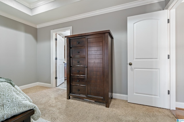 bedroom featuring crown molding and light colored carpet