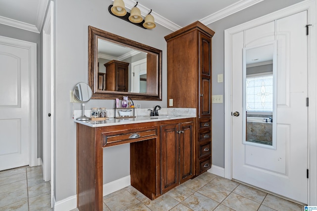 bathroom with tile patterned floors, vanity, and crown molding