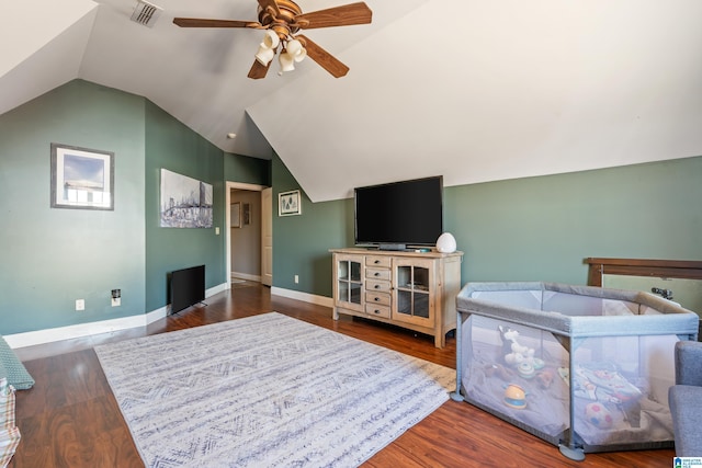 living room featuring ceiling fan, lofted ceiling, and wood-type flooring