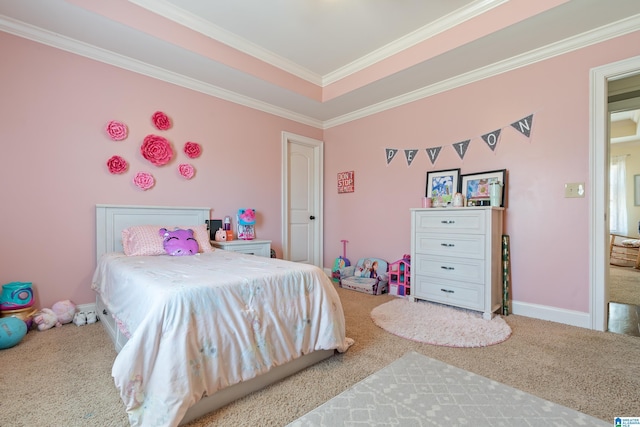 carpeted bedroom with a tray ceiling and crown molding