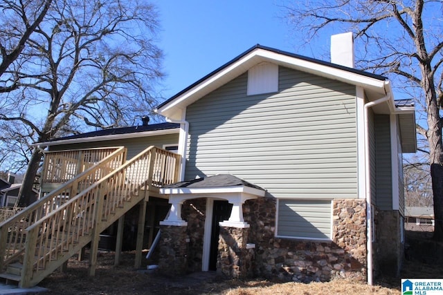 view of side of property featuring a deck