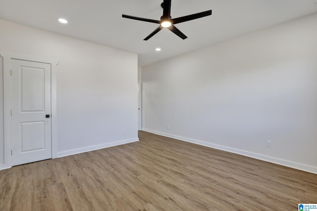 unfurnished room featuring ceiling fan and light hardwood / wood-style flooring