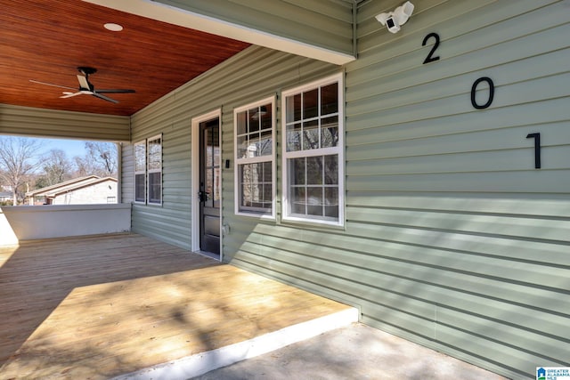 deck featuring a porch and ceiling fan