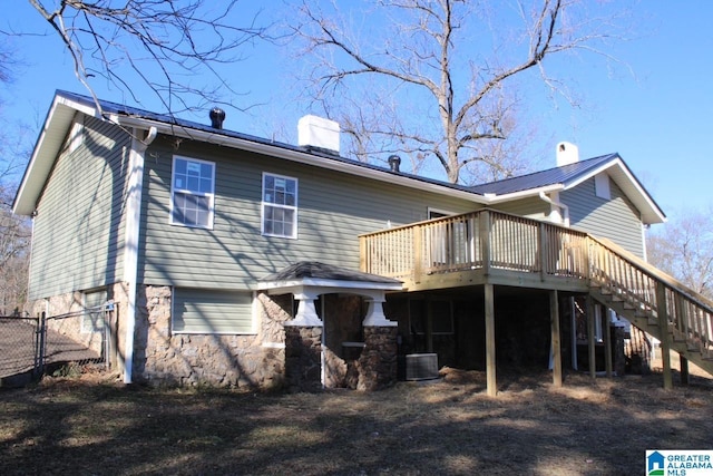 back of house featuring a deck