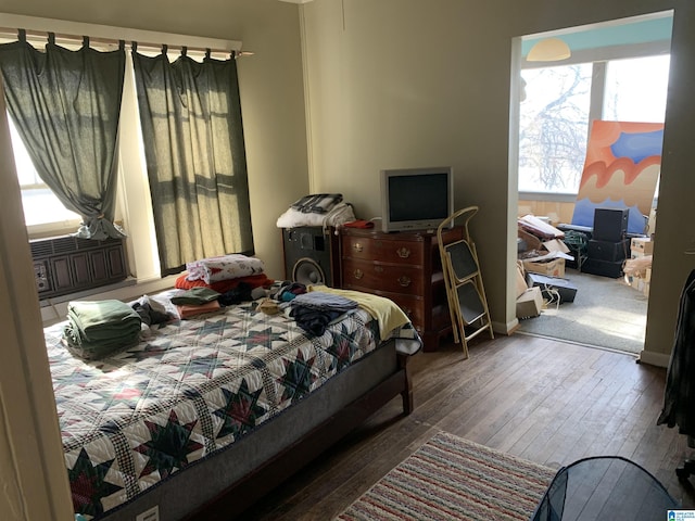 bedroom with wood-type flooring