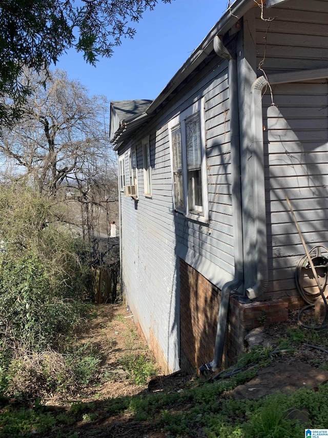 view of home's exterior with cooling unit