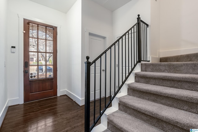 entrance foyer featuring dark hardwood / wood-style floors