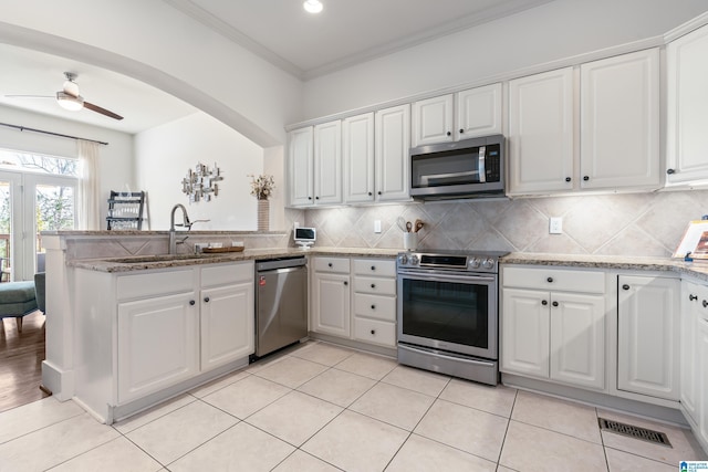 kitchen featuring sink, white cabinetry, and appliances with stainless steel finishes