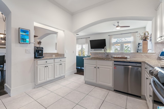 kitchen featuring ceiling fan, appliances with stainless steel finishes, and white cabinetry