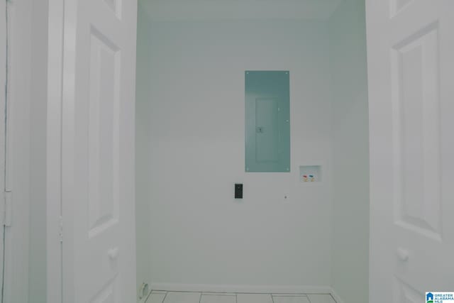 laundry area featuring light tile patterned flooring, washer hookup, and electric panel