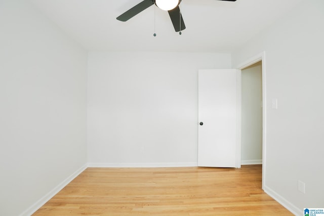 empty room with ceiling fan and hardwood / wood-style flooring