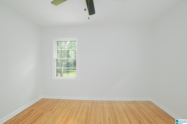 empty room with ceiling fan and light hardwood / wood-style flooring