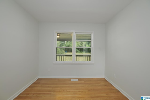 unfurnished room featuring light hardwood / wood-style flooring