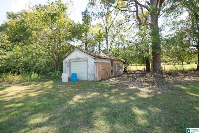 view of yard with a garage and an outdoor structure