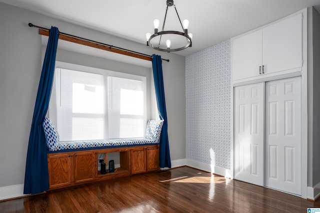 interior space featuring dark hardwood / wood-style flooring and a notable chandelier