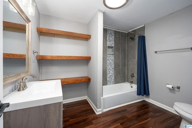 full bathroom featuring toilet, vanity, shower / bath combo with shower curtain, and hardwood / wood-style flooring