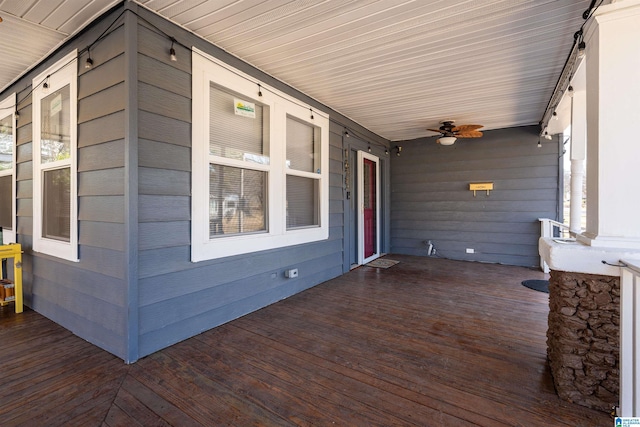 wooden terrace featuring ceiling fan