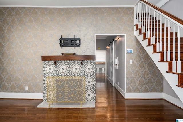 interior space featuring wood-type flooring and crown molding