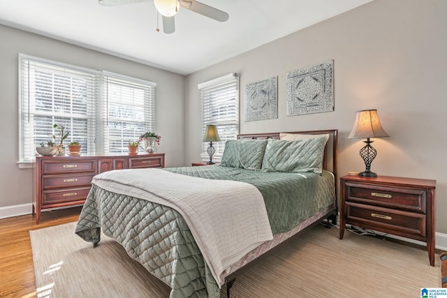 bedroom featuring light hardwood / wood-style flooring and ceiling fan