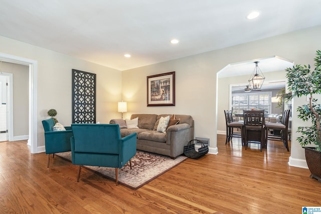 living room featuring a notable chandelier and hardwood / wood-style flooring