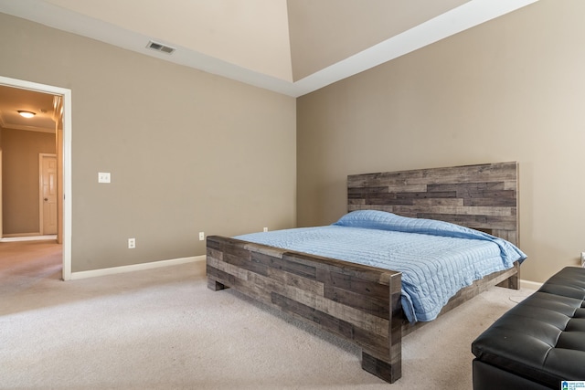 bedroom featuring ornamental molding and carpet