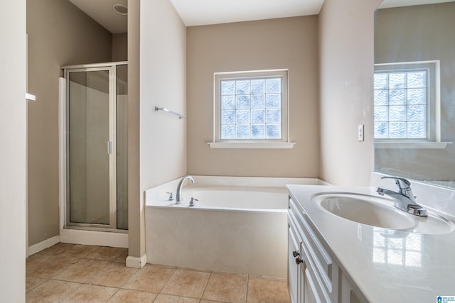 bathroom featuring separate shower and tub, a wealth of natural light, and tile patterned floors