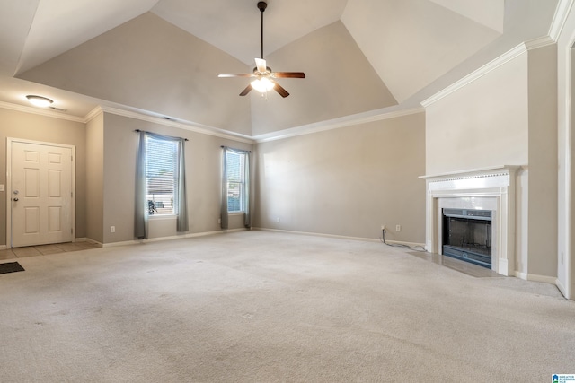 unfurnished living room with high vaulted ceiling, crown molding, light colored carpet, and ceiling fan