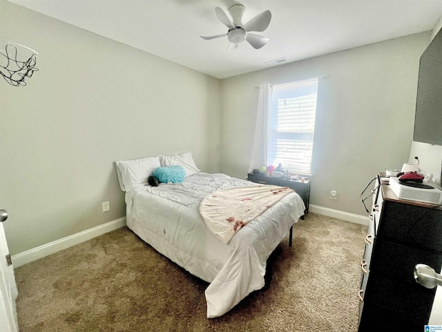 carpeted bedroom with ceiling fan