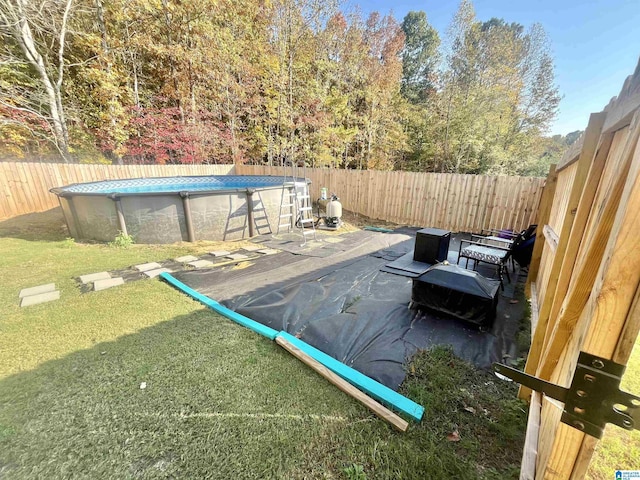 exterior space featuring a fenced in pool