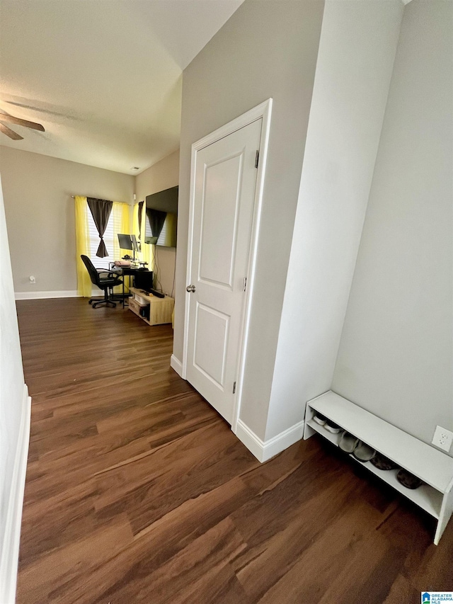 hall with dark hardwood / wood-style flooring