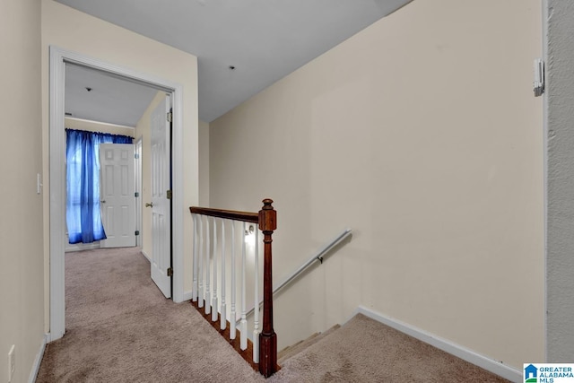 hallway with light colored carpet