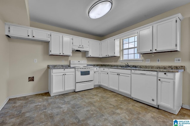 kitchen with sink, white cabinetry, dark stone countertops, and white appliances