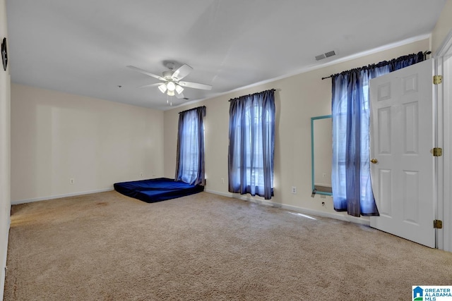 interior space featuring ceiling fan and a healthy amount of sunlight