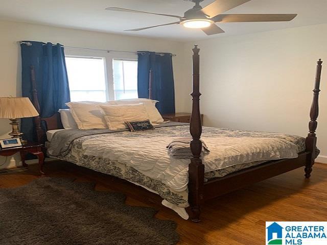 bedroom with ceiling fan and hardwood / wood-style floors