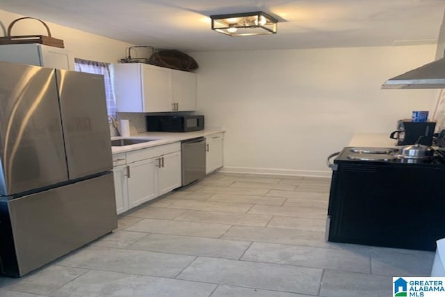 kitchen featuring black appliances, white cabinets, and sink