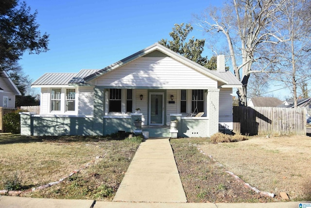 bungalow-style house featuring a front yard and a porch