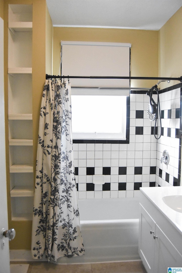 bathroom featuring vanity and shower / bath combination with curtain