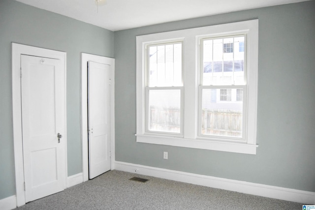 unfurnished bedroom with carpet