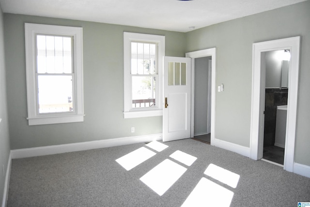 unfurnished bedroom featuring carpet flooring