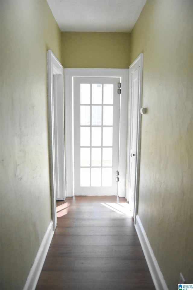 hallway with dark hardwood / wood-style floors