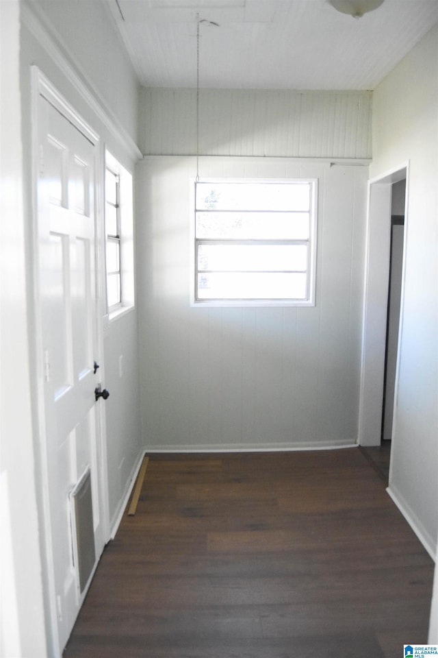 unfurnished room featuring dark hardwood / wood-style flooring