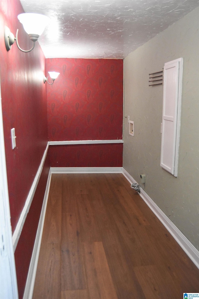 interior space with wood-type flooring and a textured ceiling