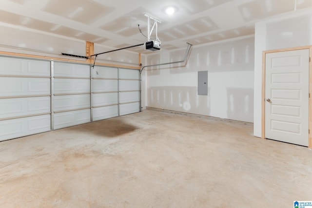 garage featuring a garage door opener and electric panel