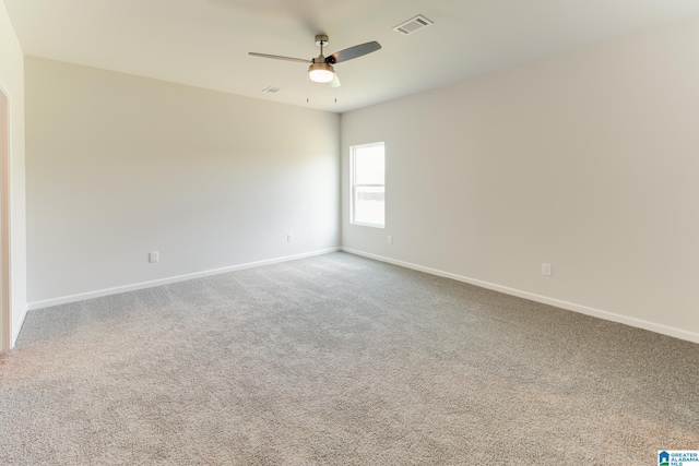 unfurnished room with ceiling fan and carpet floors